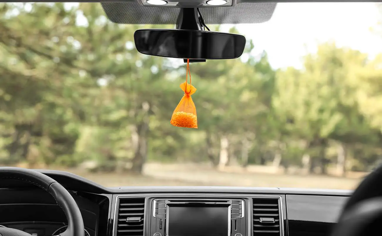 air freshener hanging on rear view mirror of car