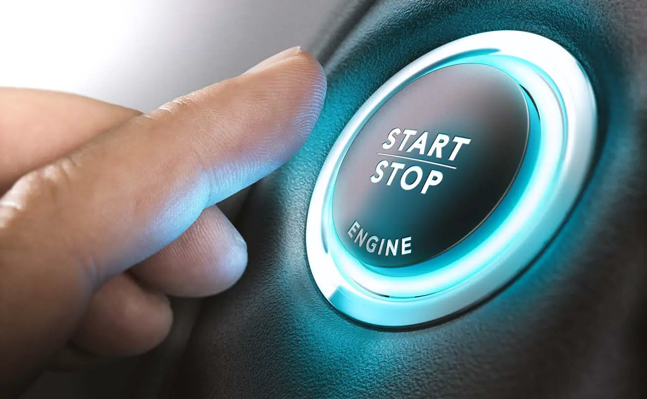 car start stop system with finger ready to press button