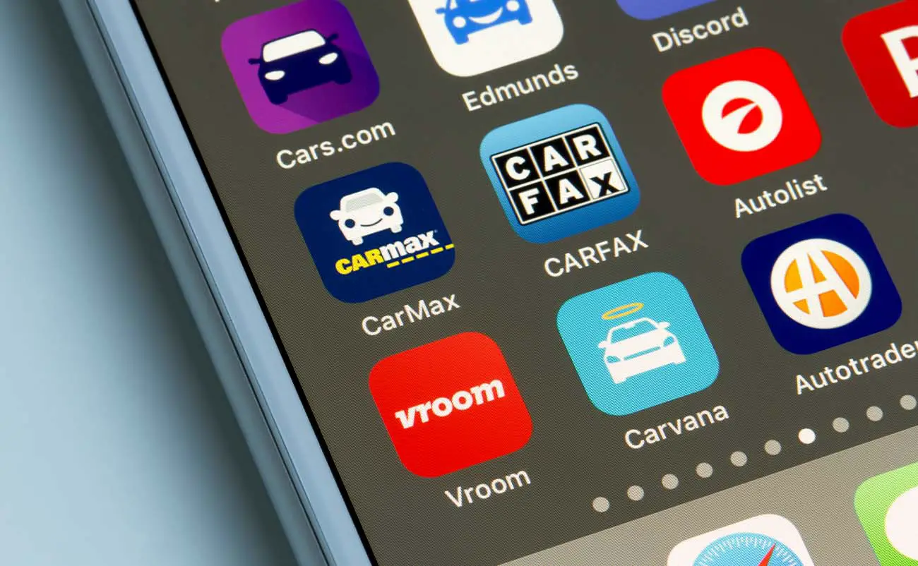 assorted car dealer mobile apps seen on a smartphone home screen carvana carmax